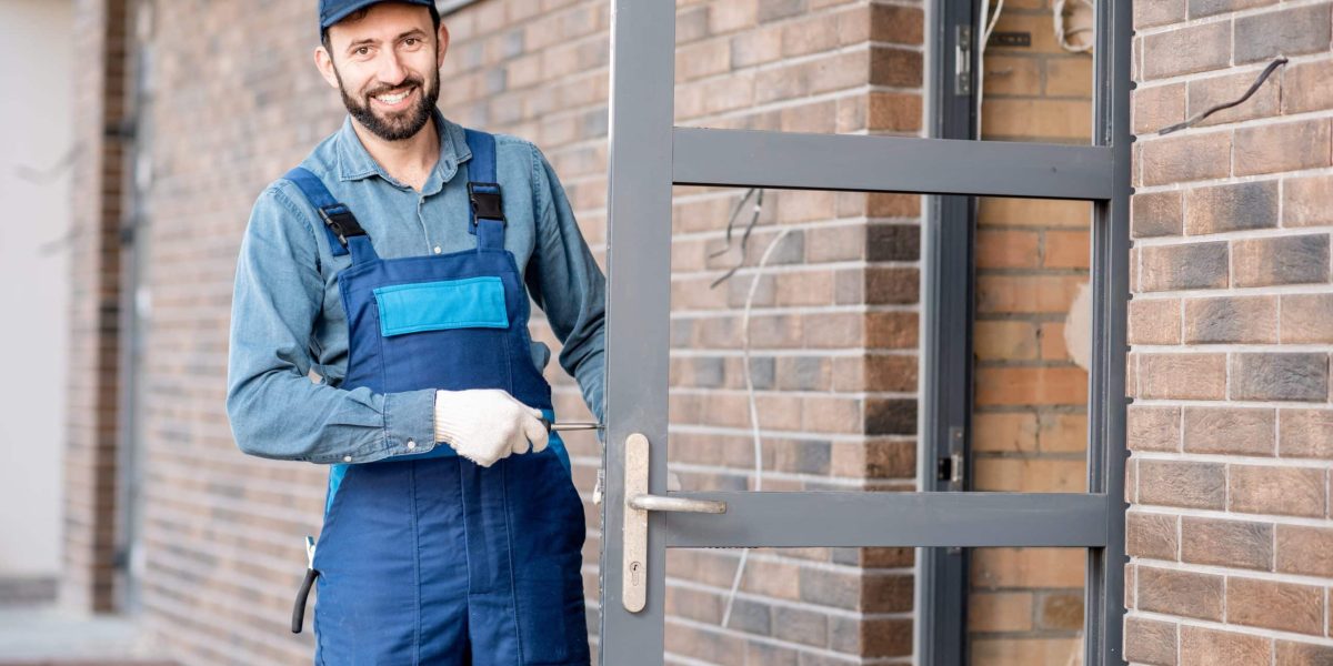 Builder installing door lock